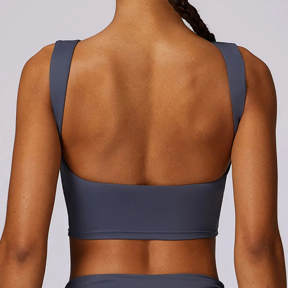 Women's blue sports bra crop top, wide back straps, scoop back design