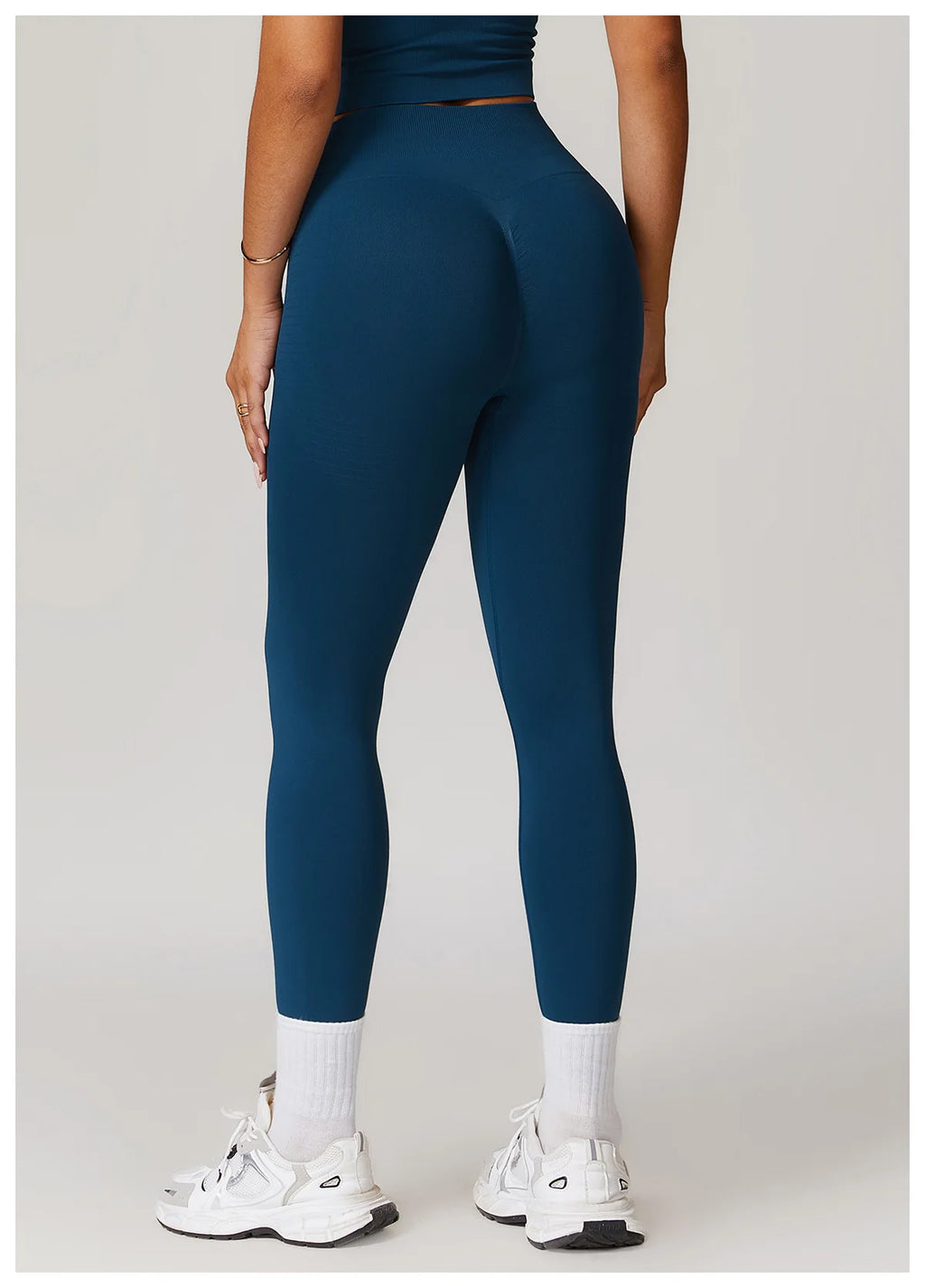 High-waisted active leggings in sea blue, back view, fitted ankle-length legs