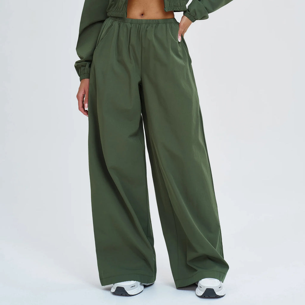 Women's wide-leg sports pants in olive green with elastic waistband