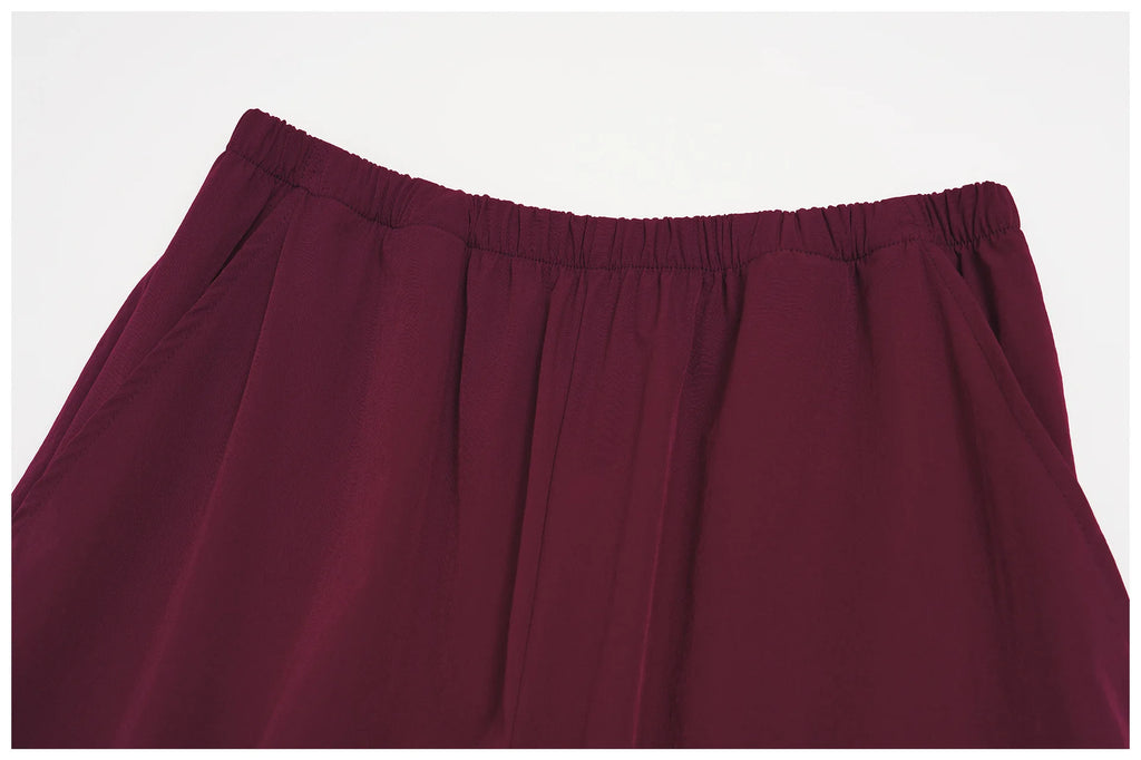 Women's wide-leg yoga pants in deep burgundy with elastic waistband