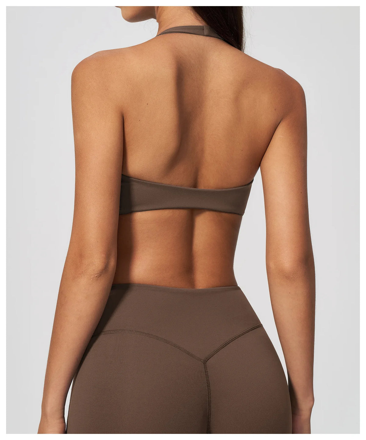 Dark brown low-back halter yoga bra with wide open-back strap section