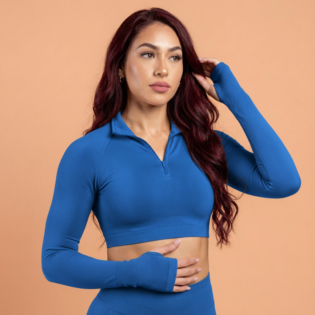 Woman wearing a blue athletic outfit against a beige background