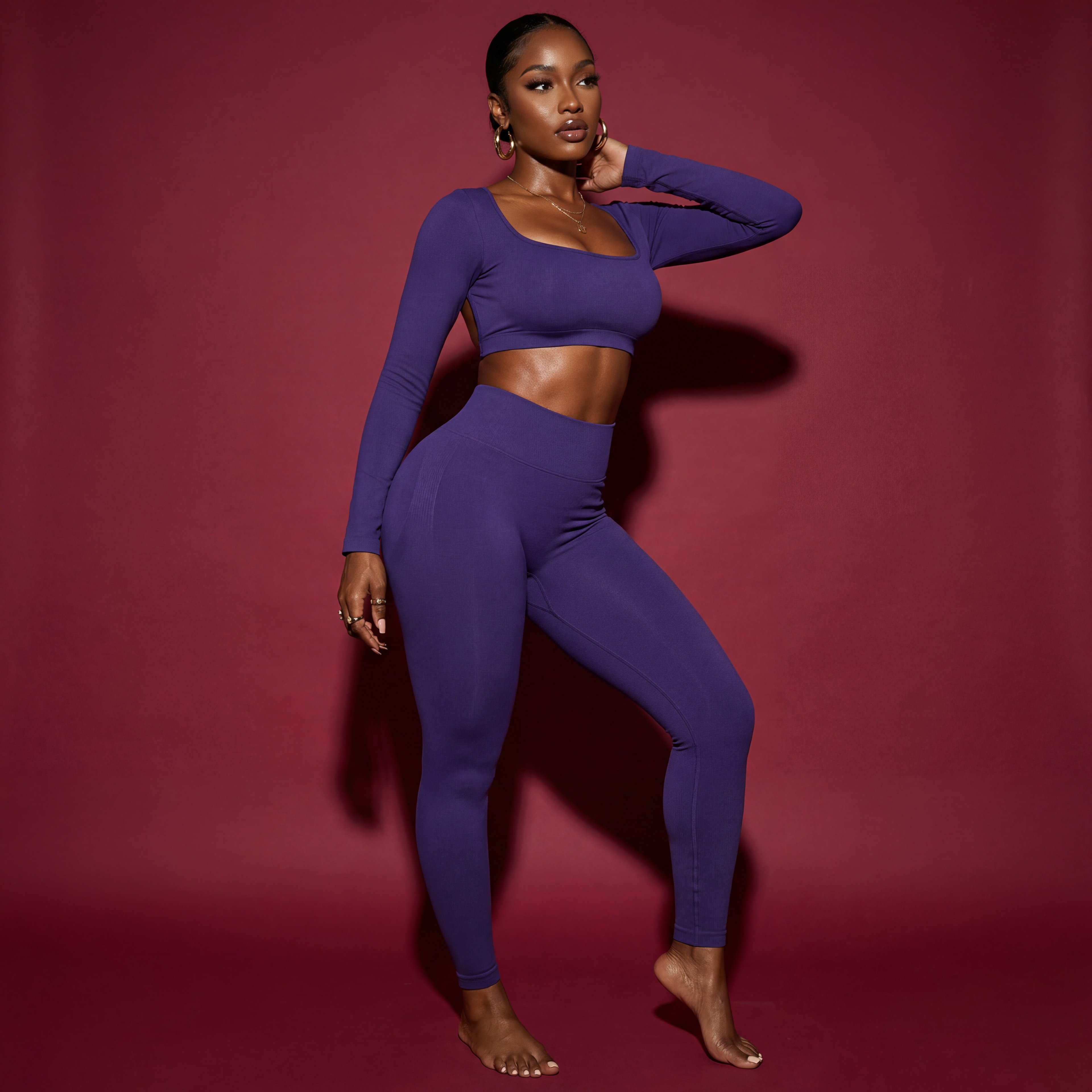 Woman wearing a blue athletic outfit against a red background