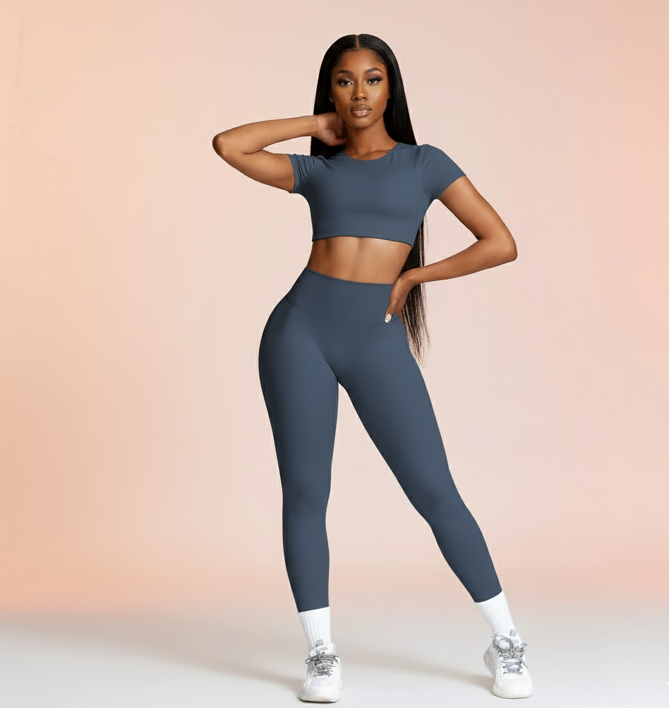 Woman wearing a blue athletic outfit on a gradient background