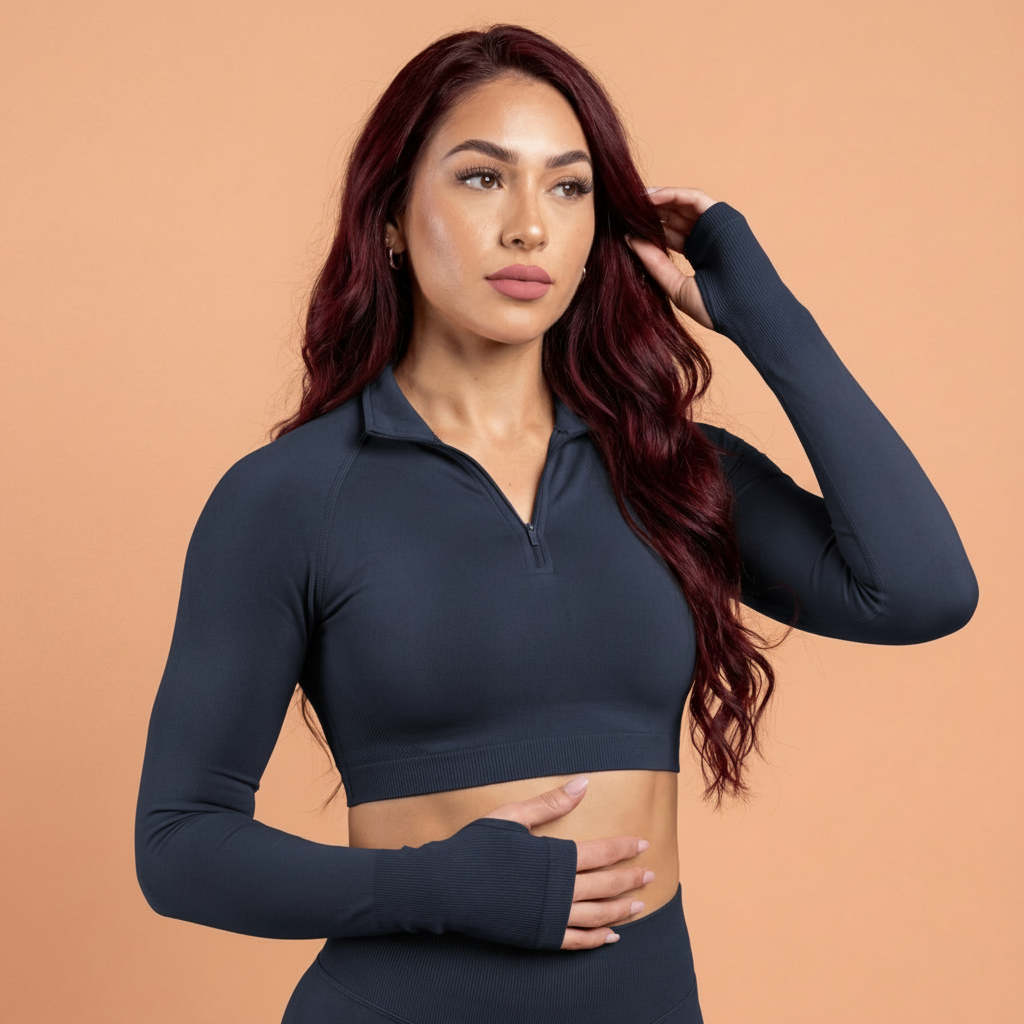 Woman wearing a dark blue athletic outfit against a beige background