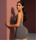 Dark grey spaghetti-strap bodysuit romper with shorts, fitted one-piece front view