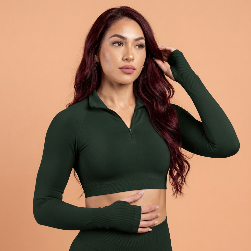 Woman wearing a green long-sleeve crop top against a beige background