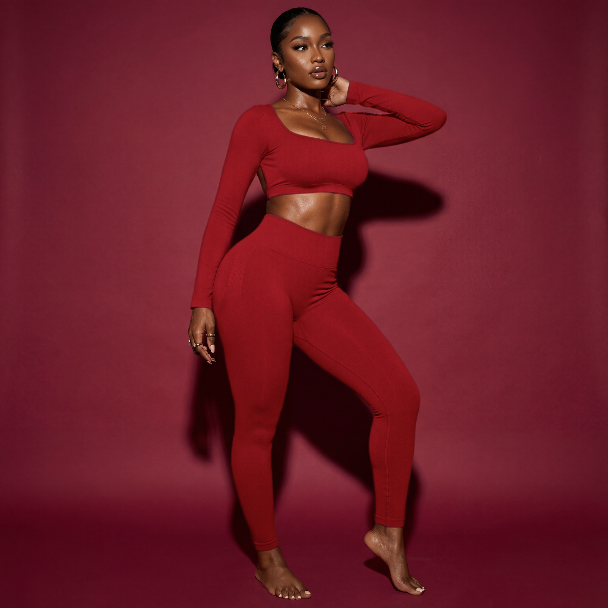 Woman wearing a red outfit against a pink background