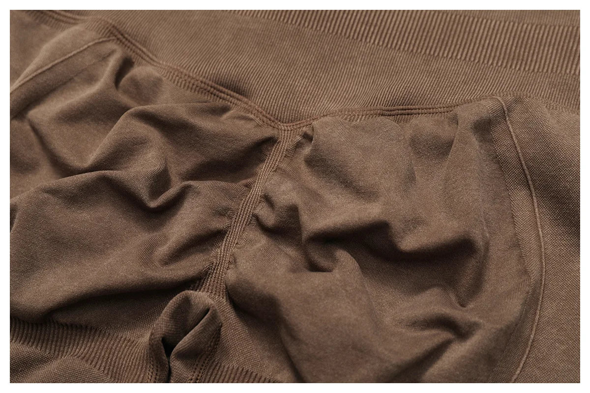 Close-up of brown Xooie Fit acid wash leggings for women showing fabric texture and stitching details