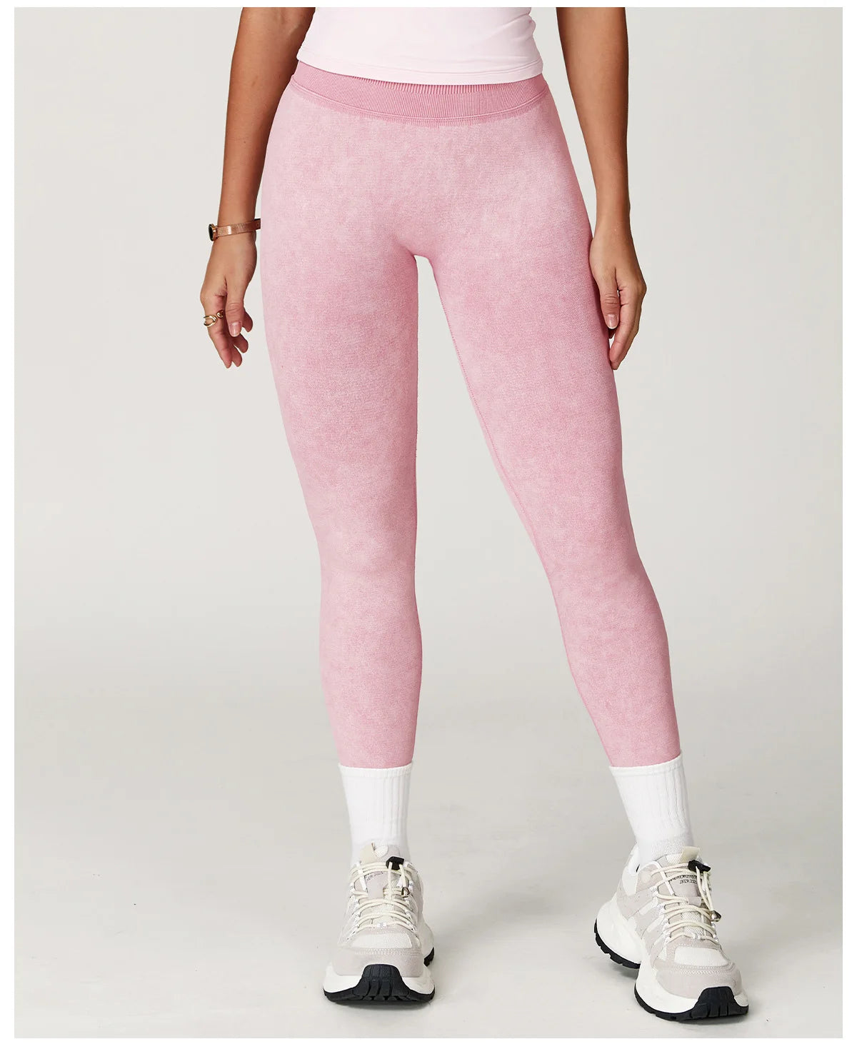 Xooie Fit pink acid wash leggings for women styled with white sneakers and socks