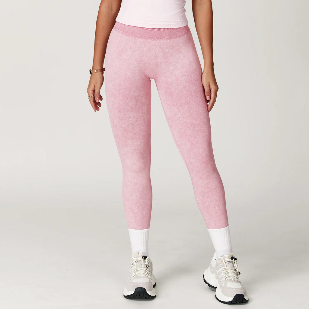 Xooie Fit pink acid wash leggings for women worn with white sneakers and socks