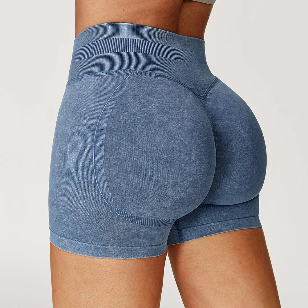 Xooie Fit acid wash workout shorts in blue with high waistband and contoured design for a flattering fit