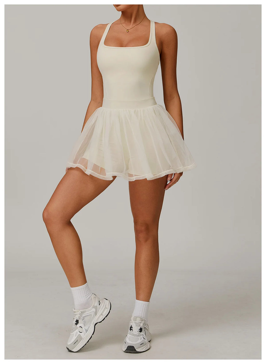 Light ivory sleeveless active dress with gathered sheer tulle mini skirt