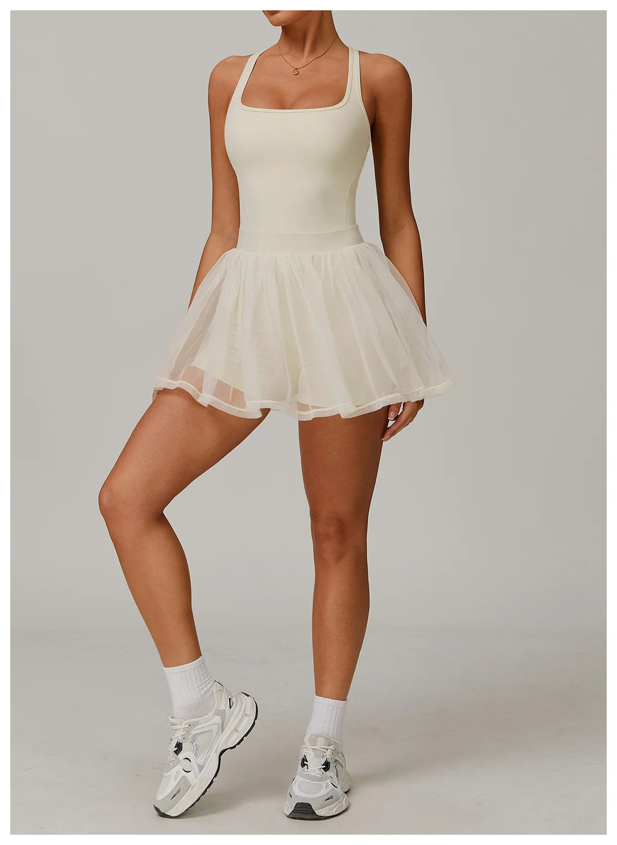 Light ivory sleeveless active dress with gathered sheer tulle mini skirt