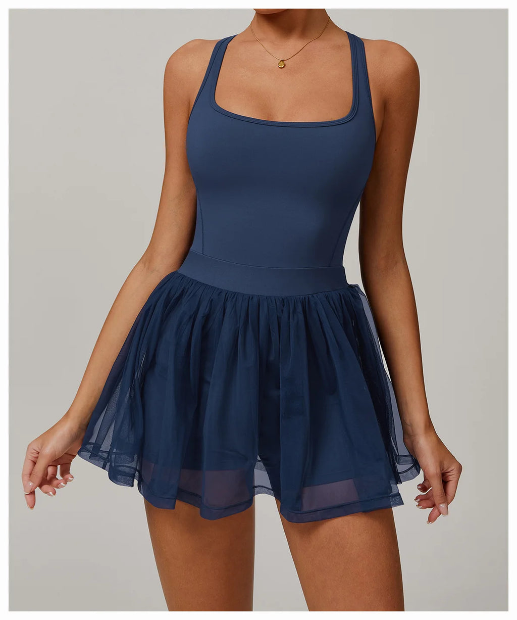 Navy blue front view active dress with square neckline and sheer pleated skirt