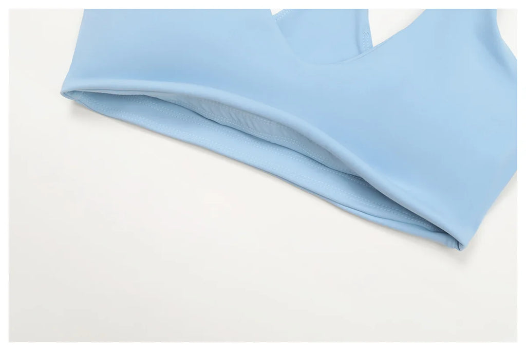 Crystal blue sports bra hem with visible seam detail