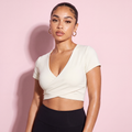 White short-sleeve cross-over crop top with V-neck and smooth wrap front
