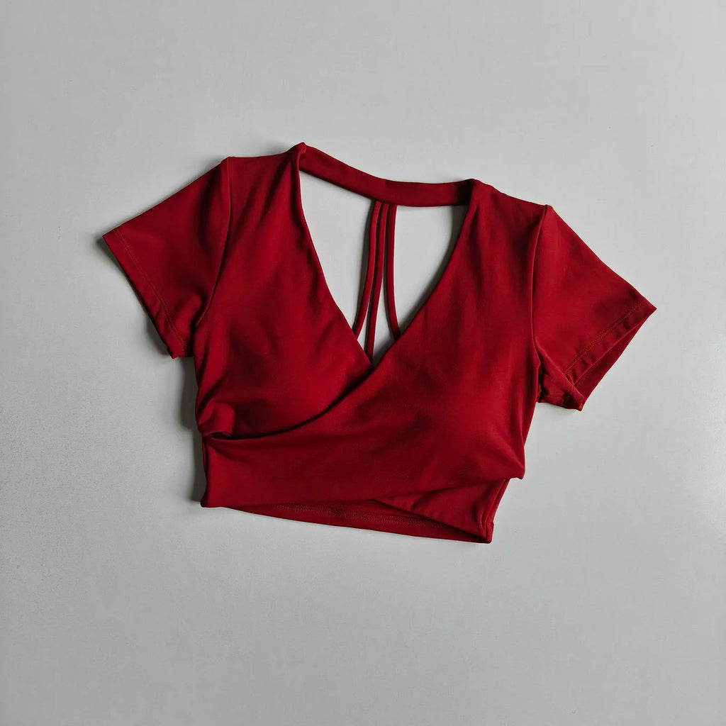 Wine red short-sleeve cross-over active crop top with crisscross open back straps