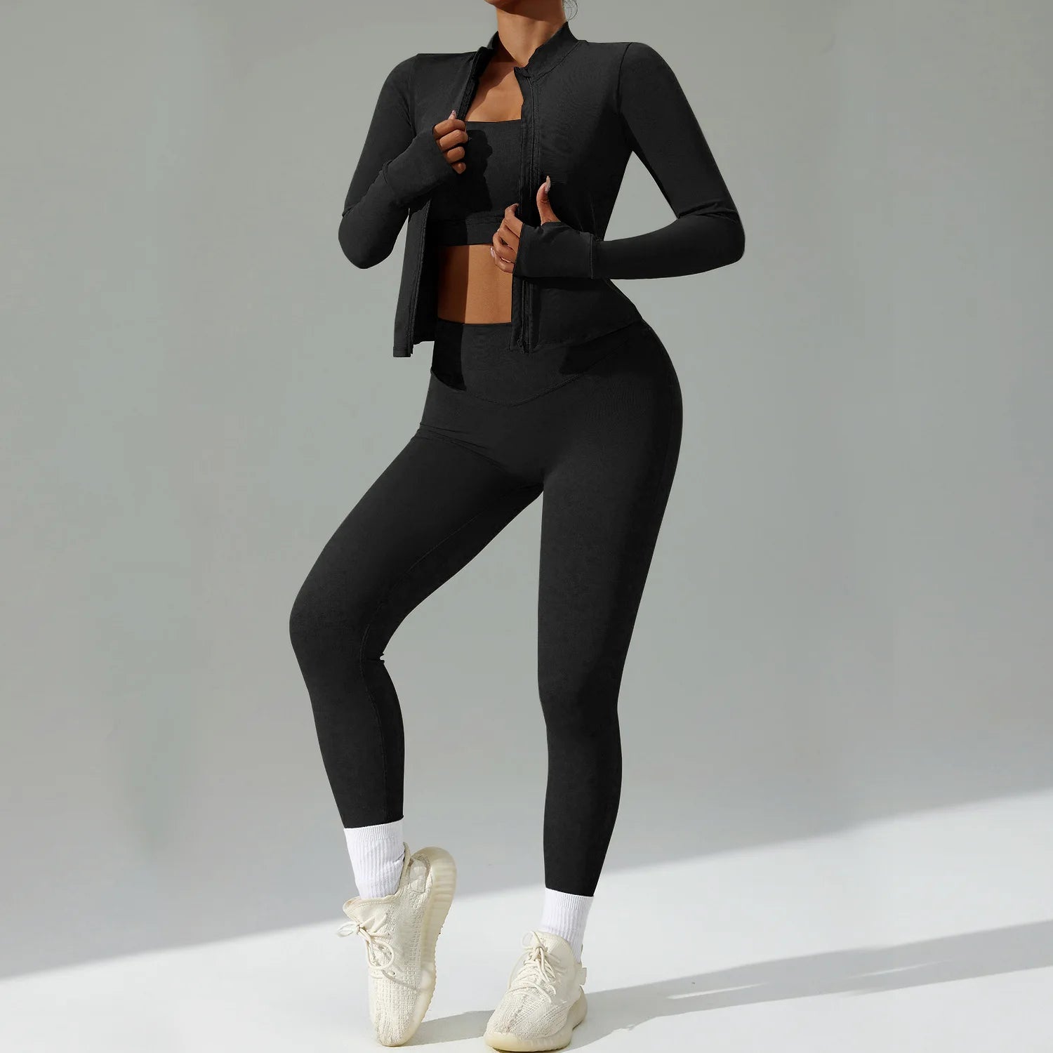 Xooie Fit 3-piece activewear set in black featuring a jacket, tank top, and leggings for workouts