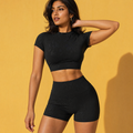 Black fitted active crop top and high-waist shorts, short sleeves, matching set