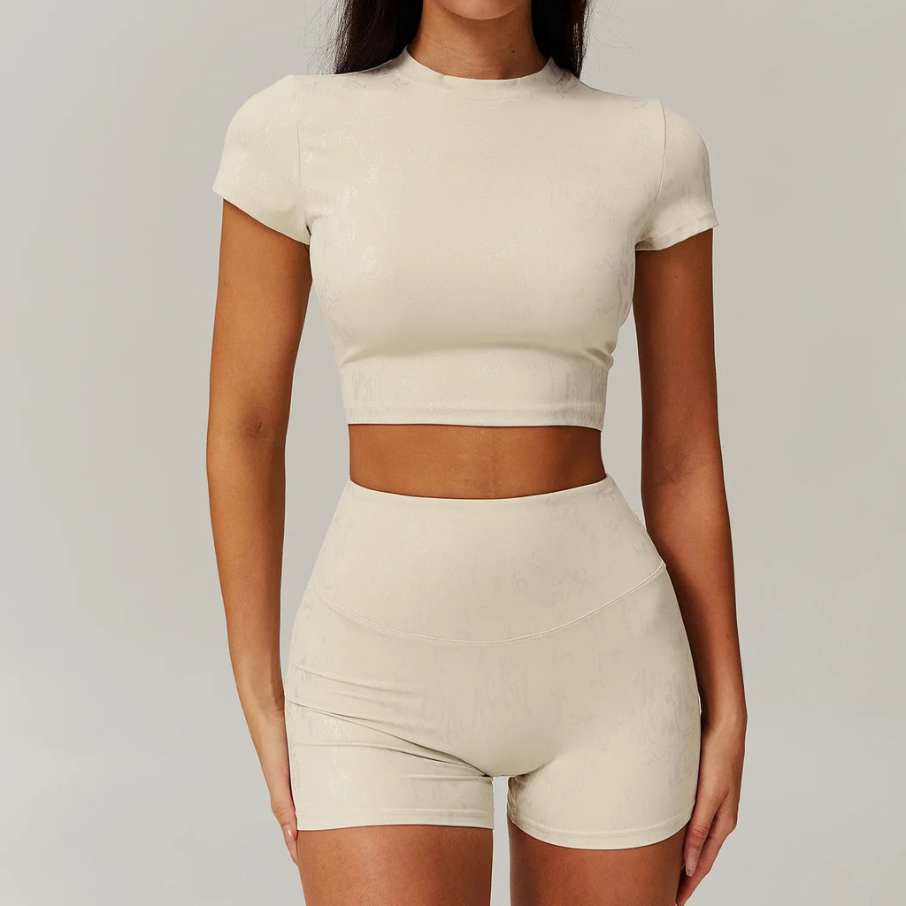 Light ivory matching active crop top and high-waist shorts set, short sleeves