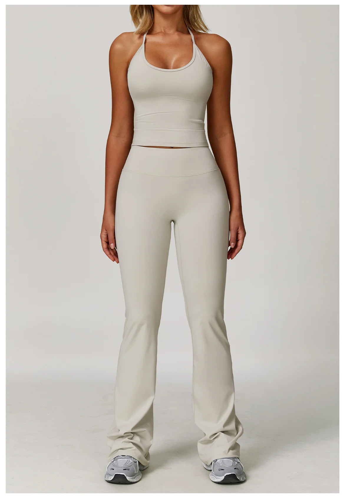 Xooie Fit Two-Piece Set featuring halter tank high-waisted flared pants activewear in light beige