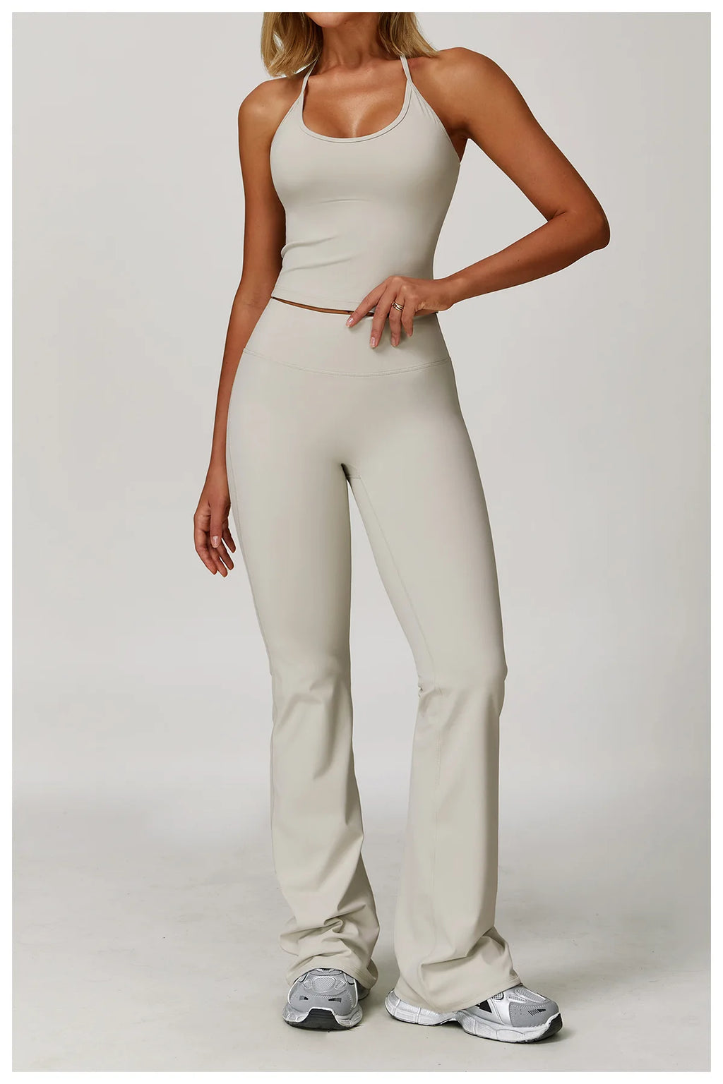 Xooie Fit Two-Piece Set featuring halter tank high-waisted flared pants activewear in a neutral tone