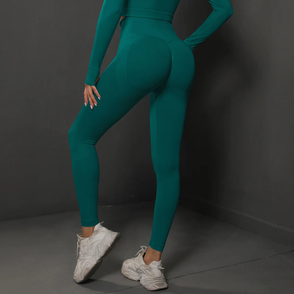 High-waist teal yoga leggings, back side view with slim leg fit and ankle length