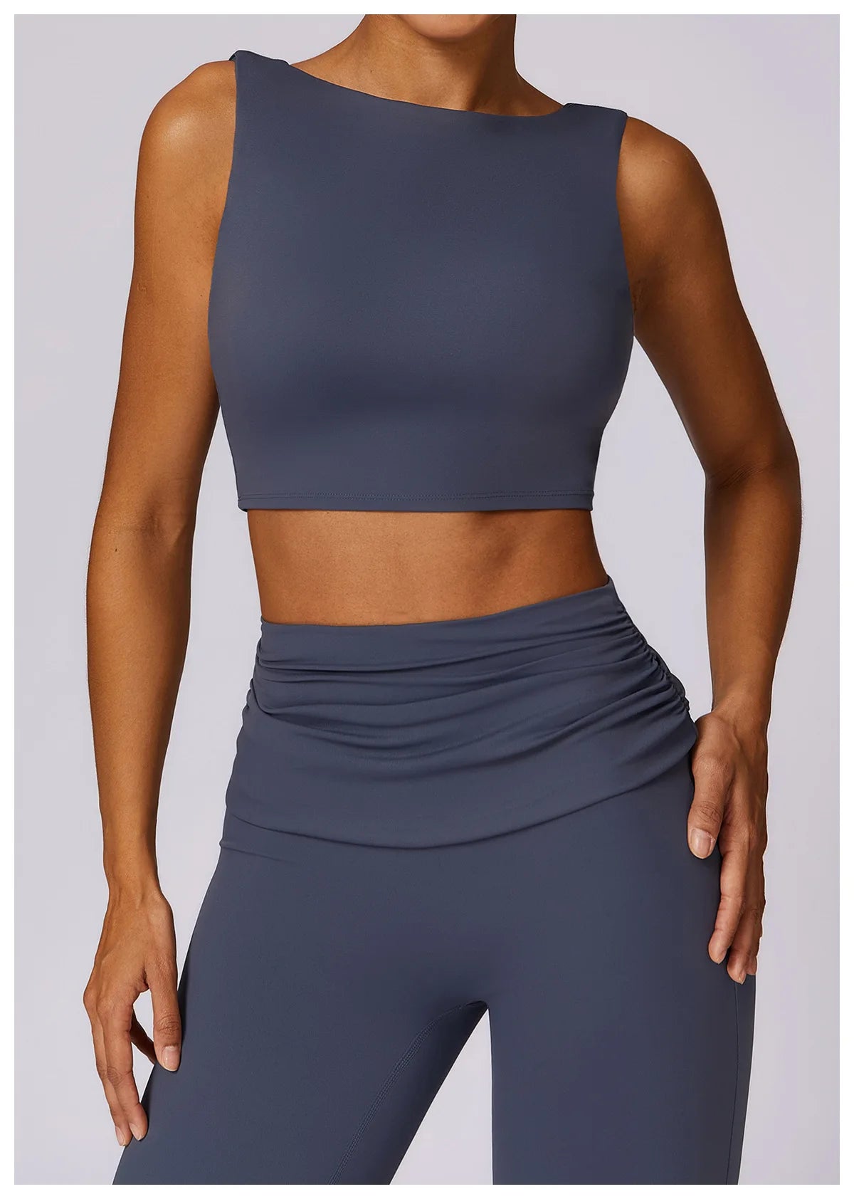 Women’s navy sleeveless sports bra crop top with ruched front waist detail