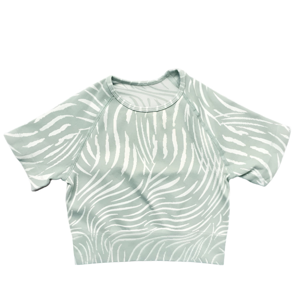 Xooie Fit women's fitted activewear set featuring a stylish cropped top with a zebra print design
