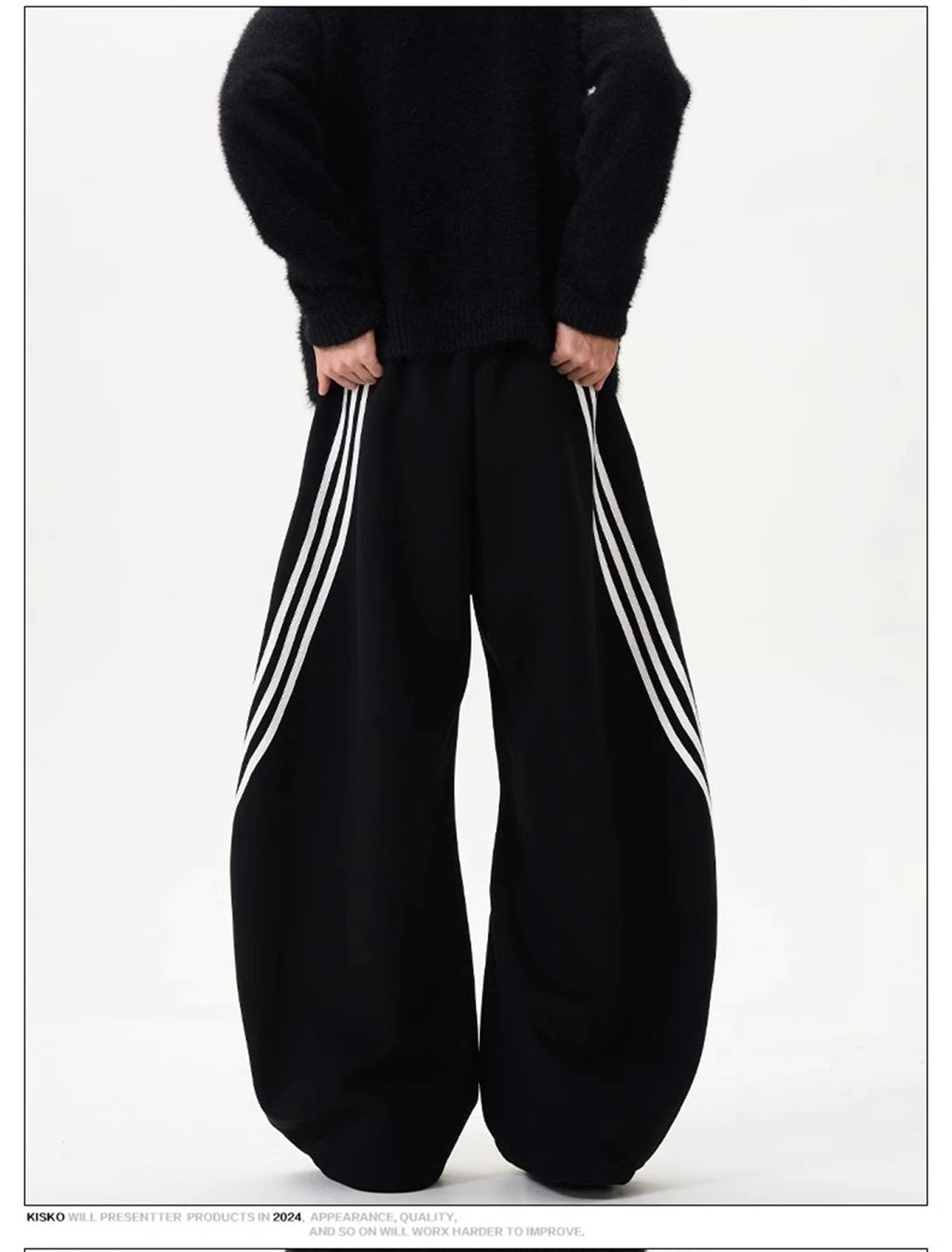 Wide-leg sweatpants shown in black and dark navy, each with striped side panels.