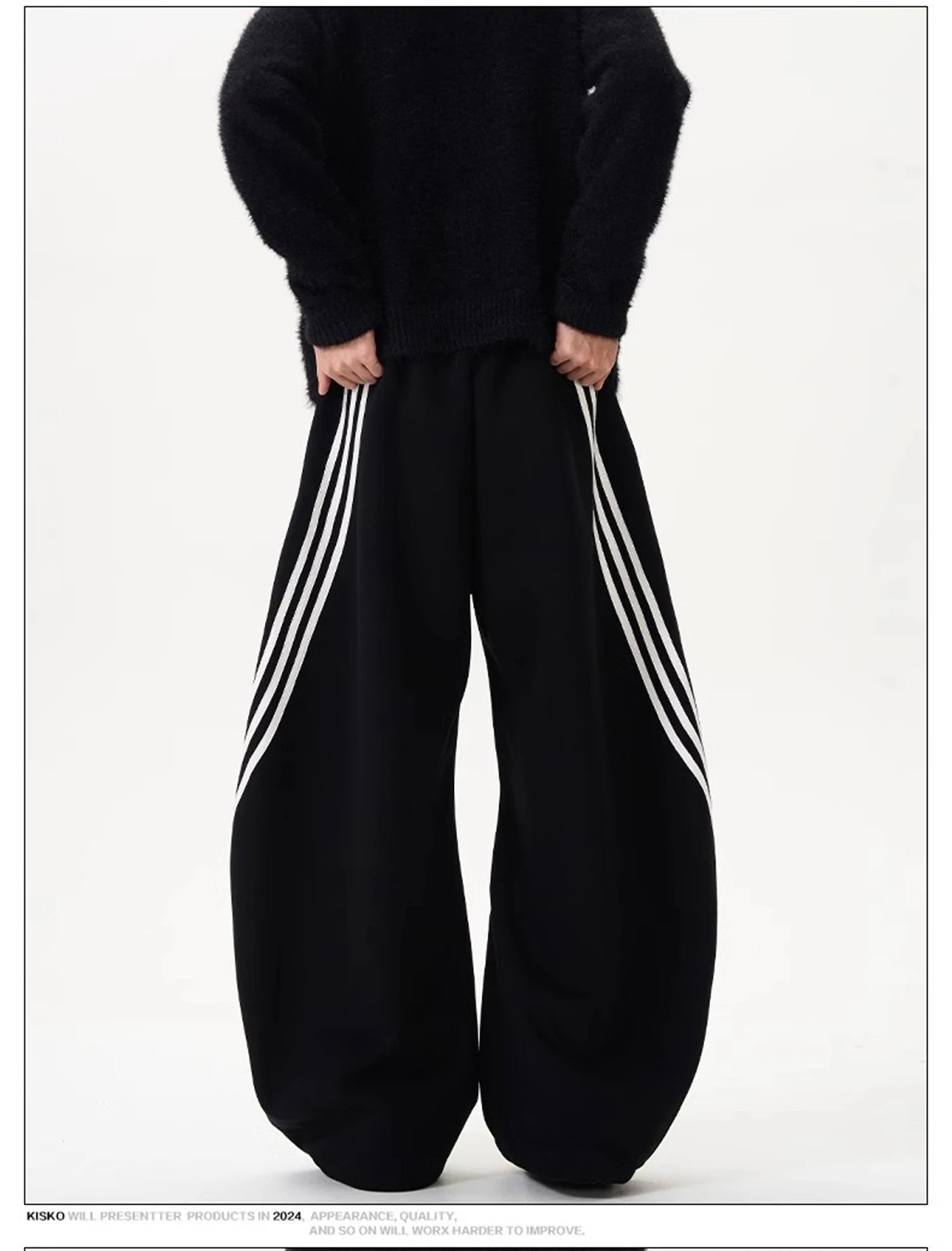 Wide-leg sweatpants shown in black and dark navy, each with striped side panels.