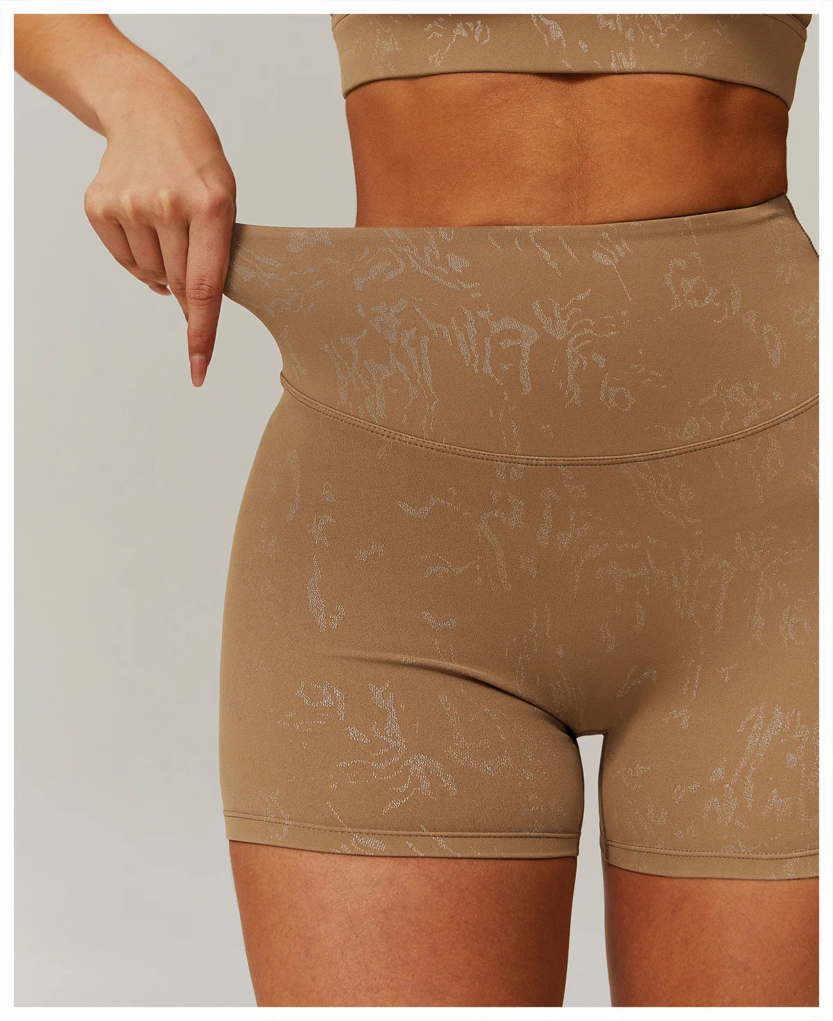 Xooie Fit beige animal print active shorts with high waist and stretch fabric for workout