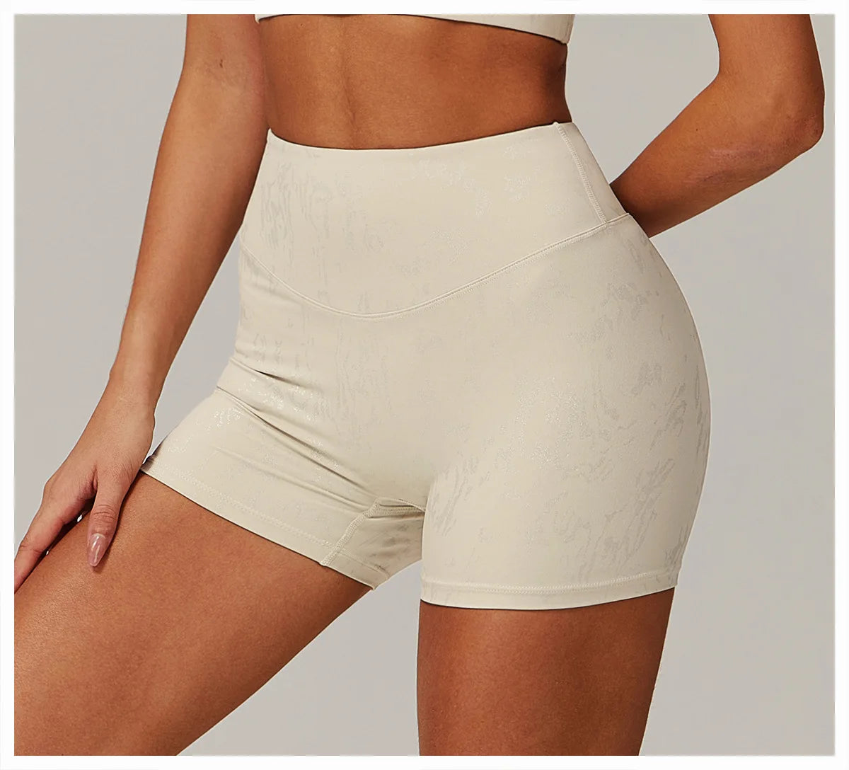 Xooie Fit beige animal print active shorts with high waist and snug fit for women