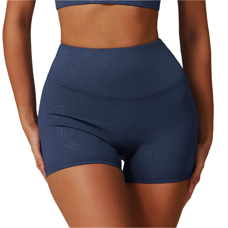 Xooie Fit navy animal print active shorts with high waist and subtle pattern on model