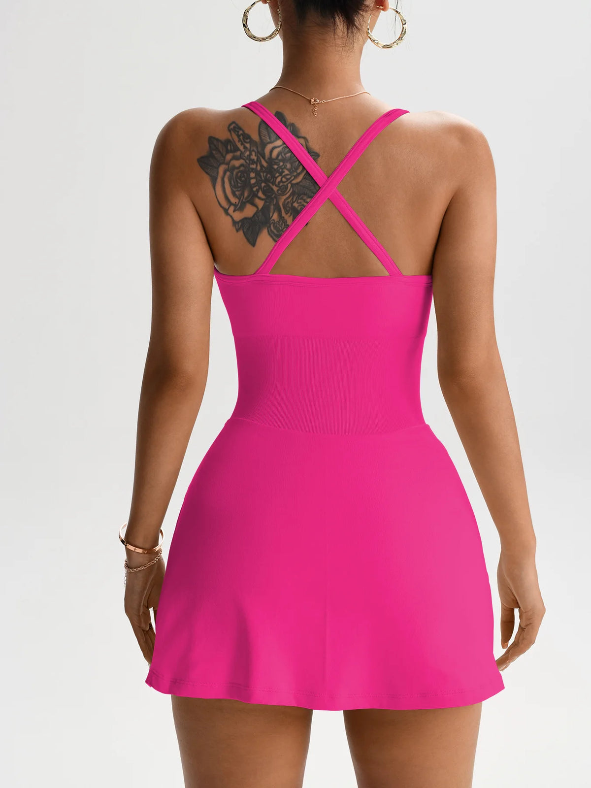 Women’s tennis skort dress with open X-back straps, bright pink