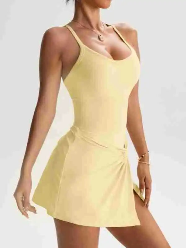 Women’s tennis skort dress with scoop neckline and twisted hem, light yellow