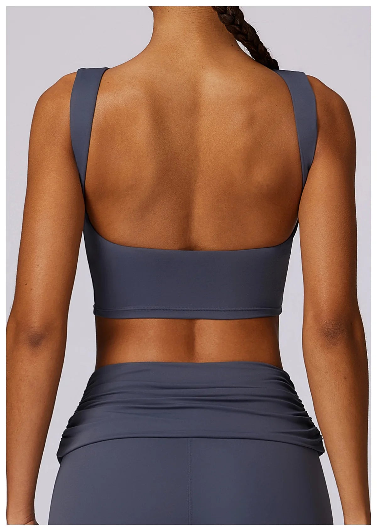 Women’s navy sports bra crop top, open back design with wide band and racerback