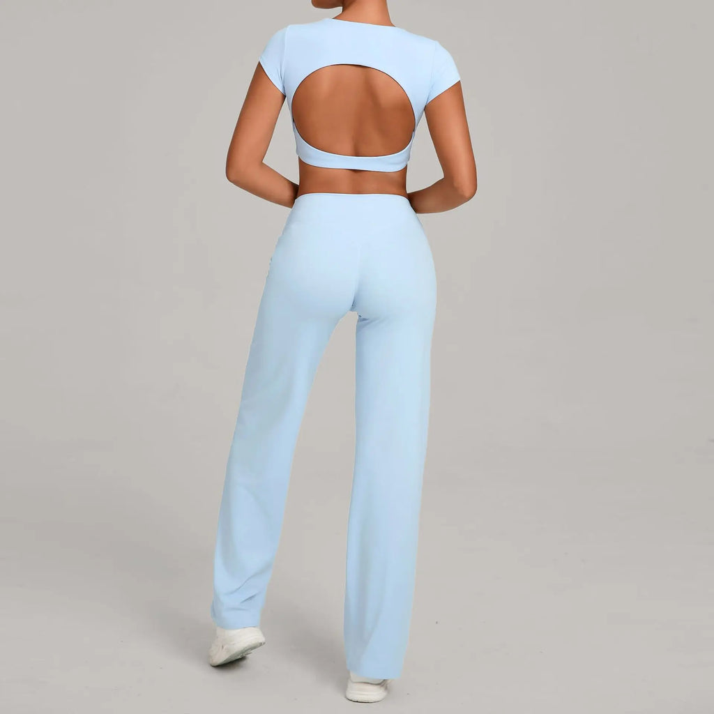 Xooie Fit backless crop top and flare pants set in light blue for a stylish summer look.
