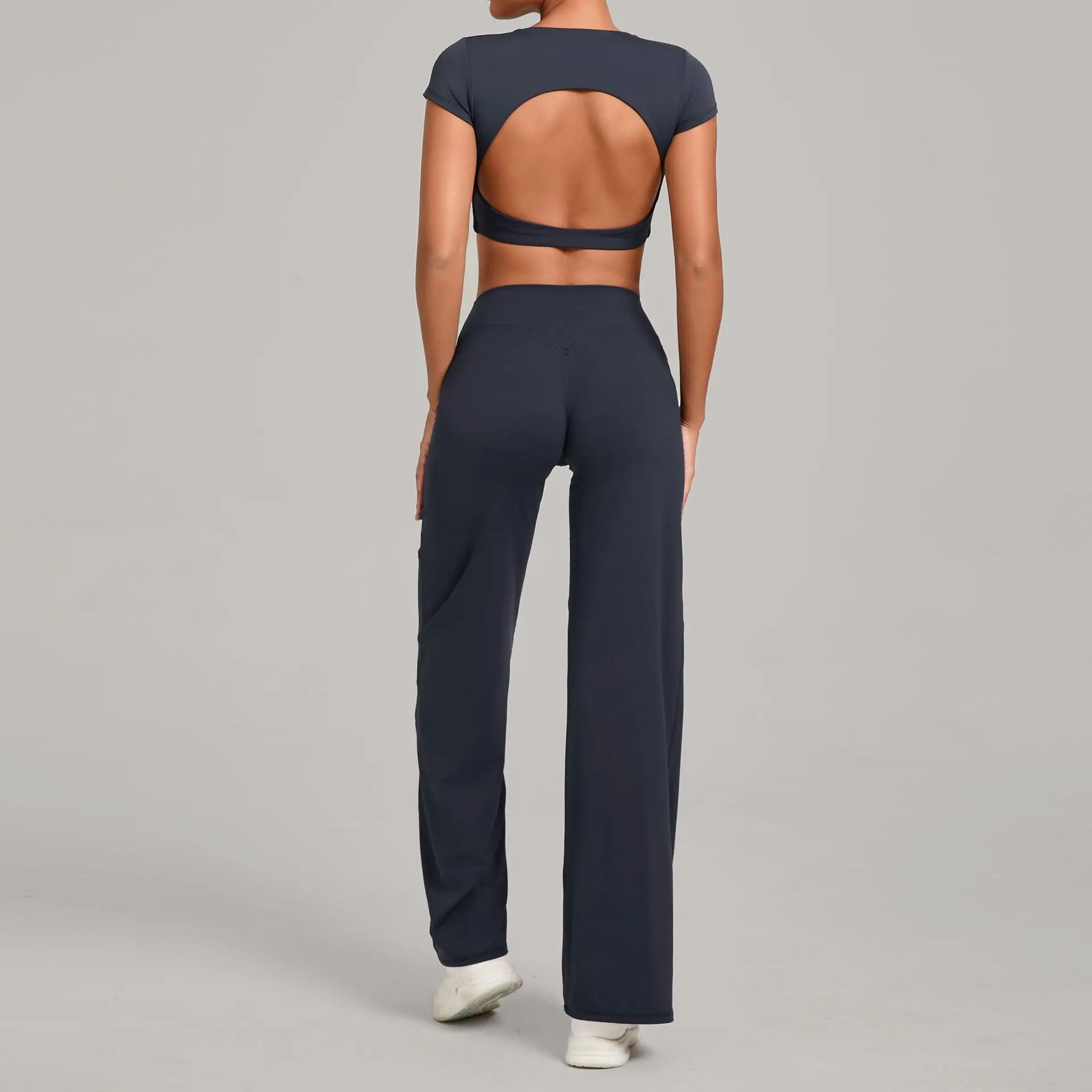 Xooie Fit backless crop top and flare pants set in navy blue, perfect for stylish and comfortable outfits