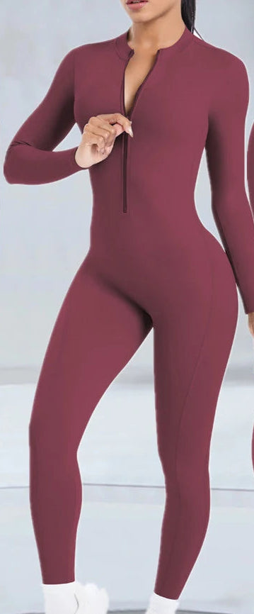 Xooie Fit Backless workout jumpsuit for women in burgundy with long sleeves and zip front detail