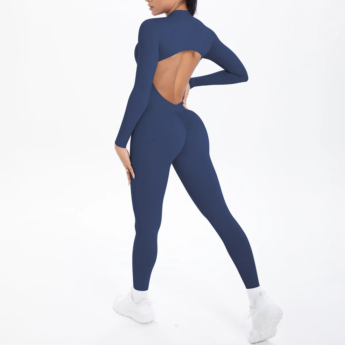 Xooie Fit backless workout jumpsuit for women in navy blue with long sleeves and a stylish cutout