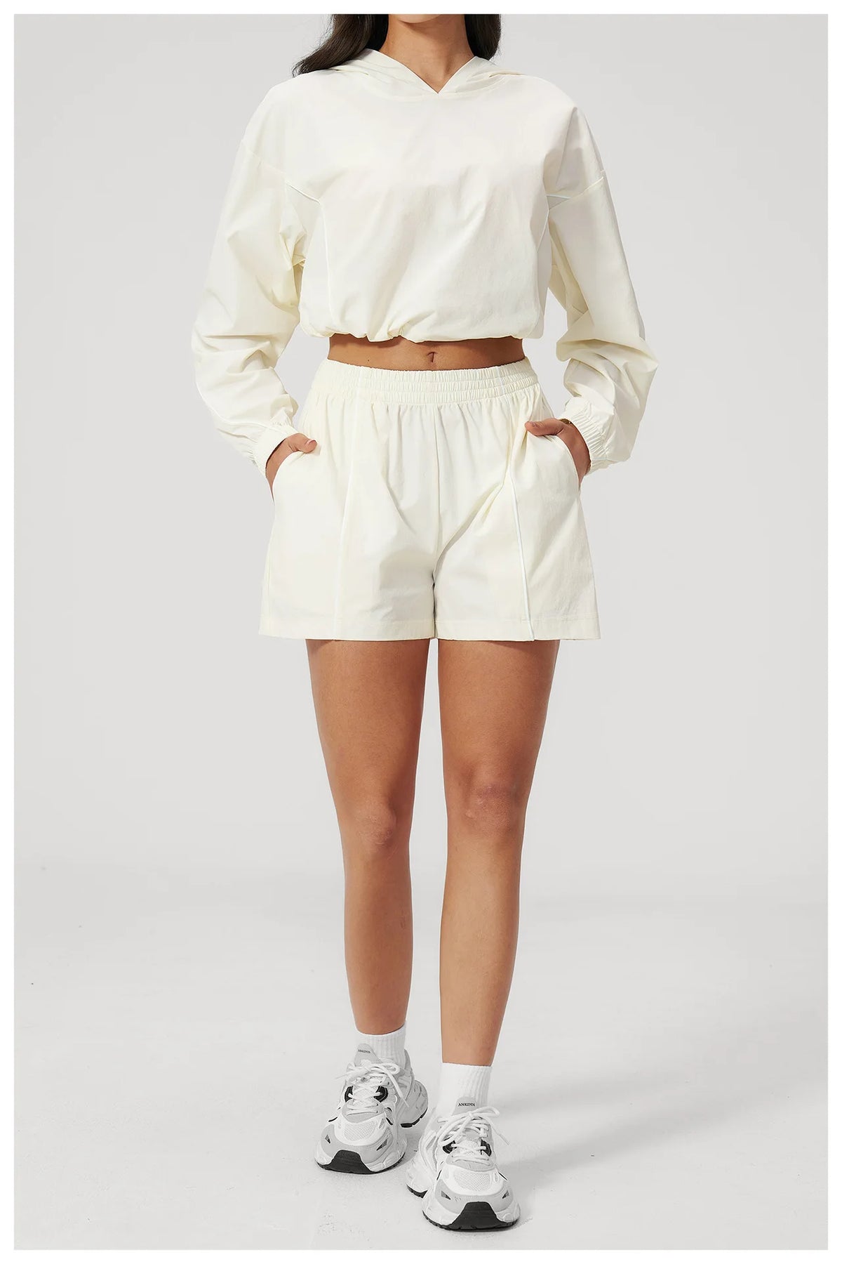 Cream hooded pullover and matching shorts set, front view, elastic waistband
