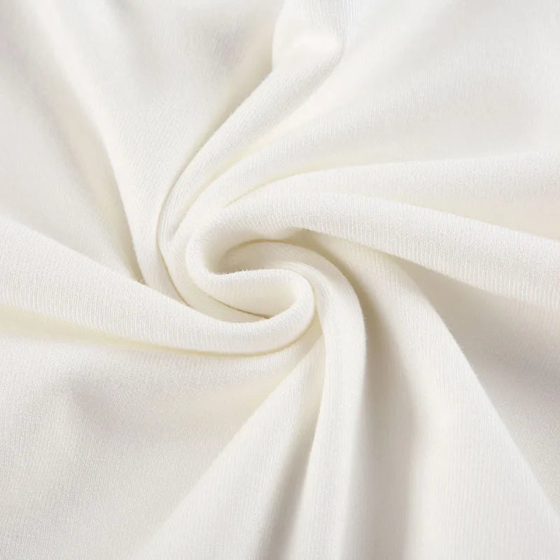 Soft white fabric of Xooie Fit baggy crop top for workouts with a smooth texture