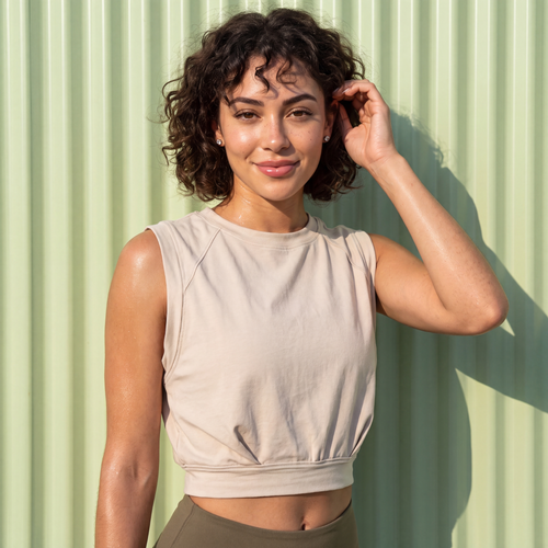 Tan sleeveless crop t-shirt with crew neckline and gathered waist hem