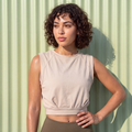 Tan sleeveless crop t-shirt with round neck and gathered waist hem