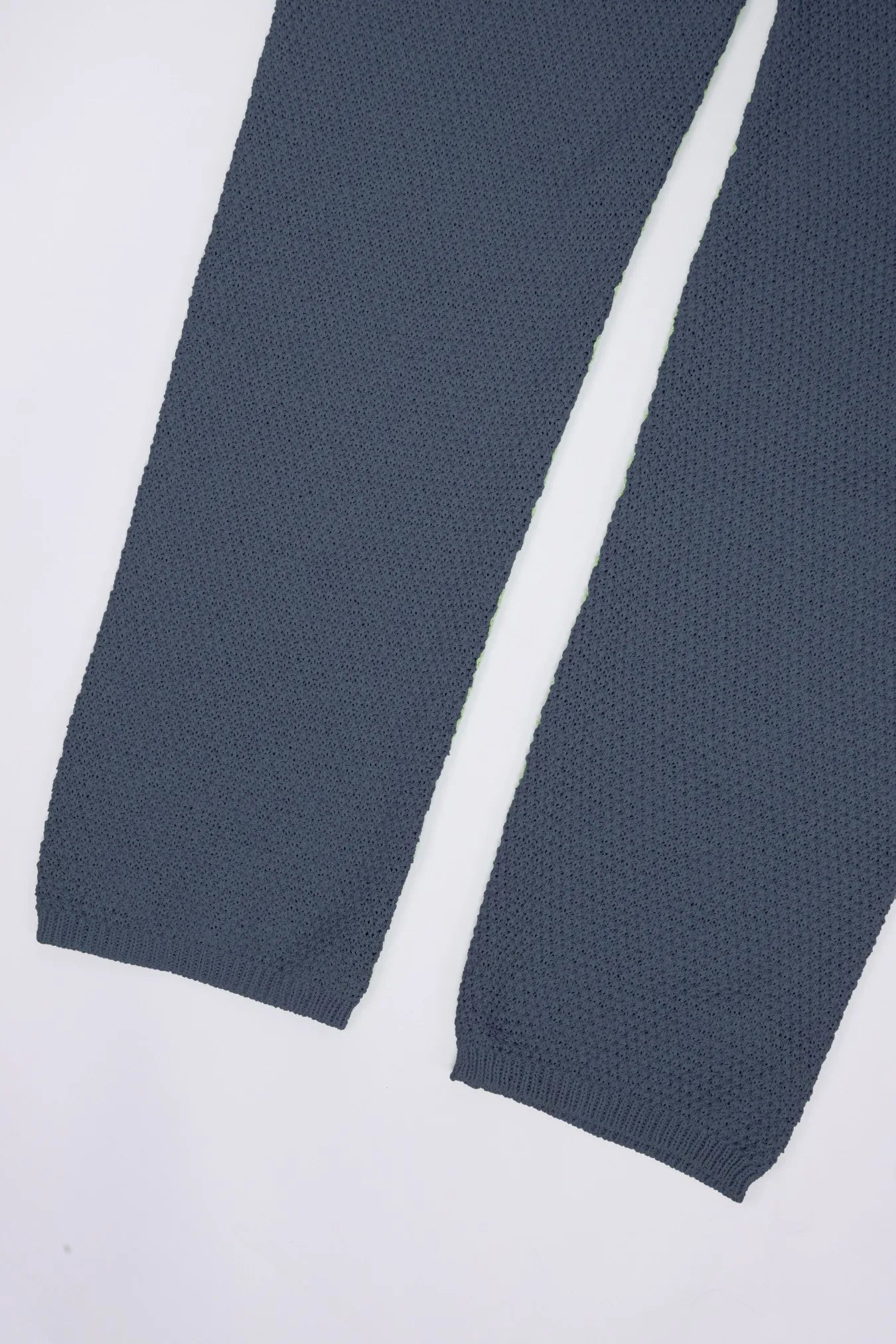 Blue knit wide-leg romper hem and leg opening