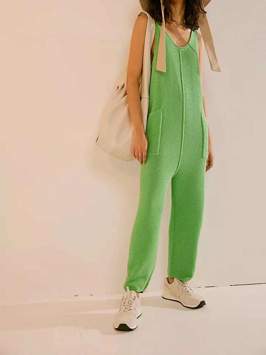 Onion green knit jumpsuit romper with wide legs, scoop back, and side pockets
