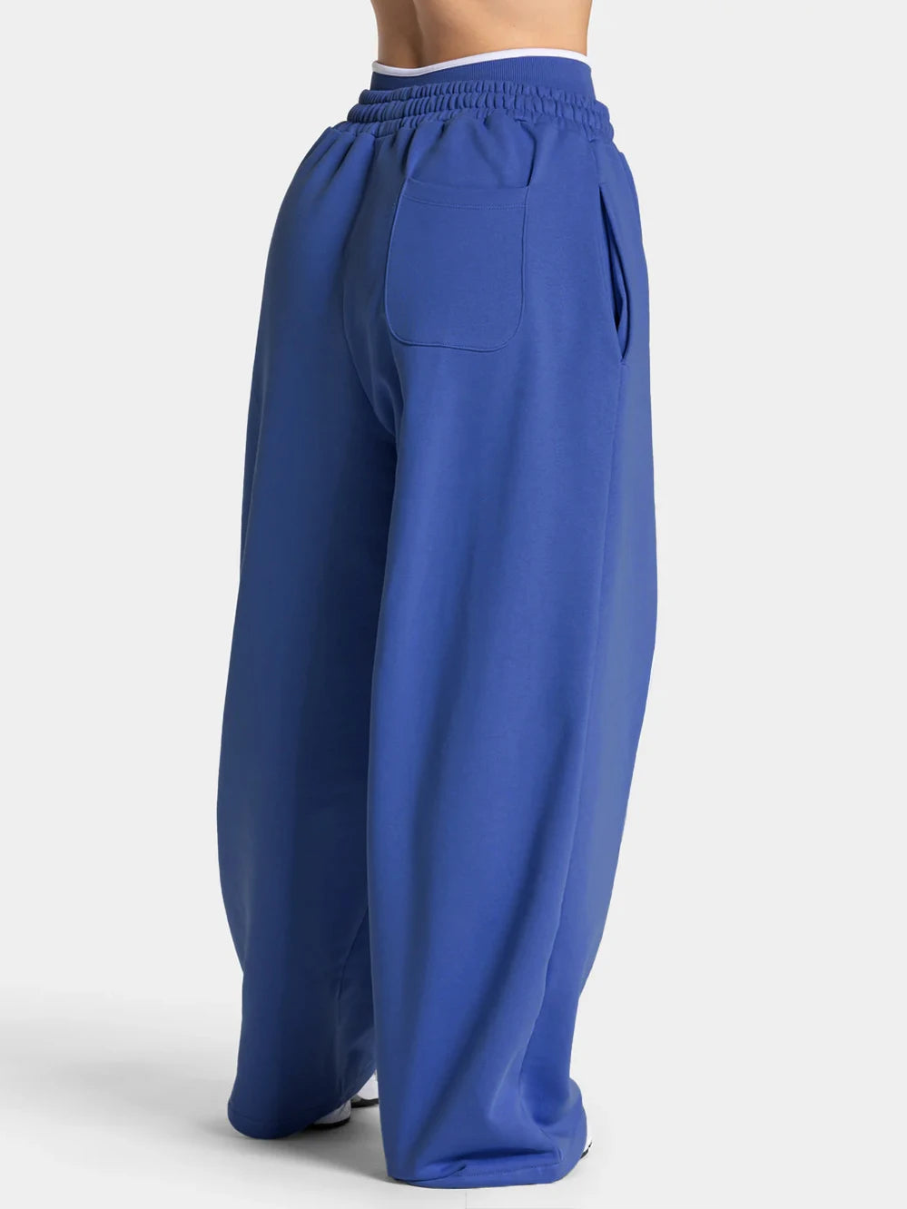 Baggy active joggers in blue with elastic waistband and front patch pocket