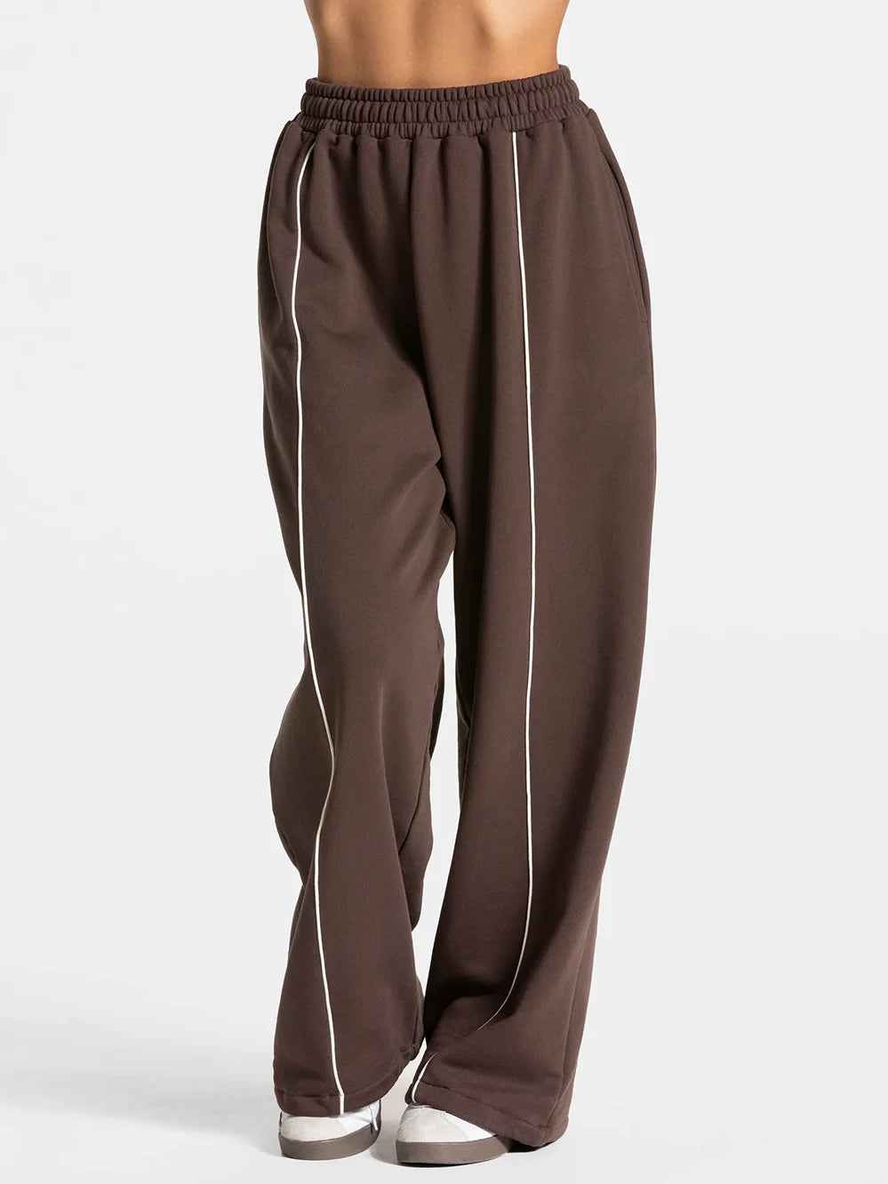 Baggy sweat joggers in coffee brown with elastic waistband and white vertical side stripe